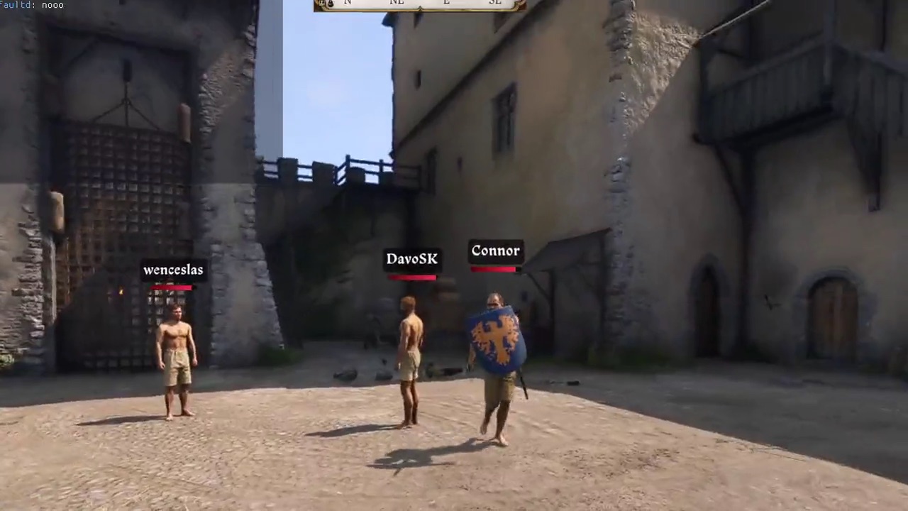 First-person view drawing a bow on a player with a sword and shield in a castle courtyard in Kingdoms Connected