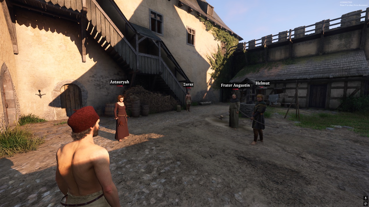 A player facing four other players with name tags in a sunlit castle courtyard in Kingdoms Connected